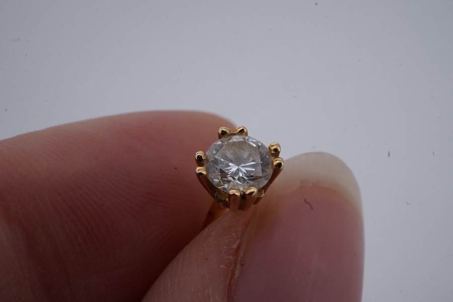 A pair of diamond ear studs, each weighing approximately 0.30 carats, mounted in gold, approximately 4.5mm diameter